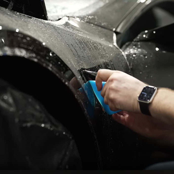 paint protection film being applied